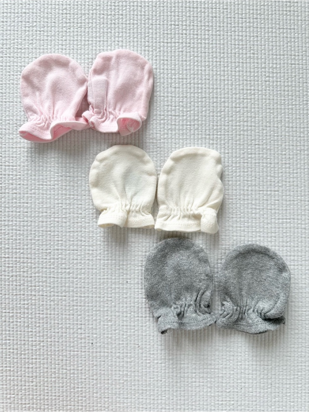 A set of 3 Baby Scratch Mittens